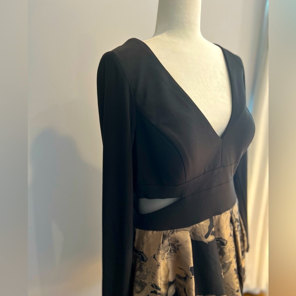 Xscape dress. Gold and black with rich details. Peak a boo sides